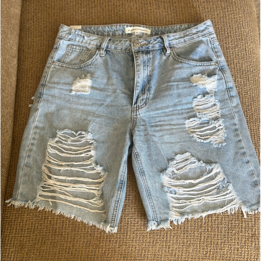 Light blue tattered jean shorts